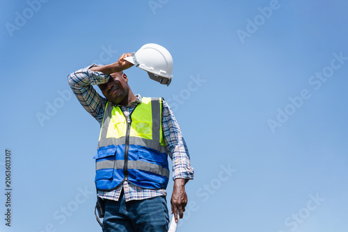 Cuadro en lienzo Tired Construction Worker Wiping Sweat Under the Hot Sun, Exhausted Engineer Tak
