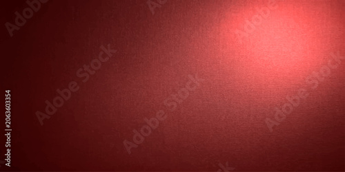 Foto A textured dark red background with a bright spotlight in the upper right corner, creating an atmospheric and dramatic effect