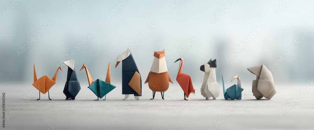 Fototapeta premium Paper animal origami collection in row with blurred background. Different colors and designs
