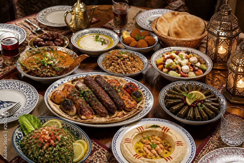 Obraz premium Assorted mezze platter with dips and grilled skewers spread