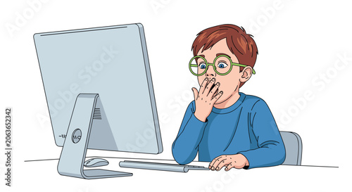 Surprised or shocked boy with glasses looking at a computer monitor with his hand over his mouth.