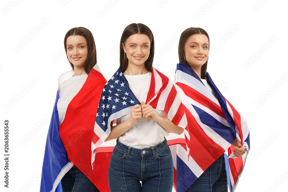 Fototapeta premium A young woman proudly displays the USA and UK flags, celebrating diversity and travel, PNG