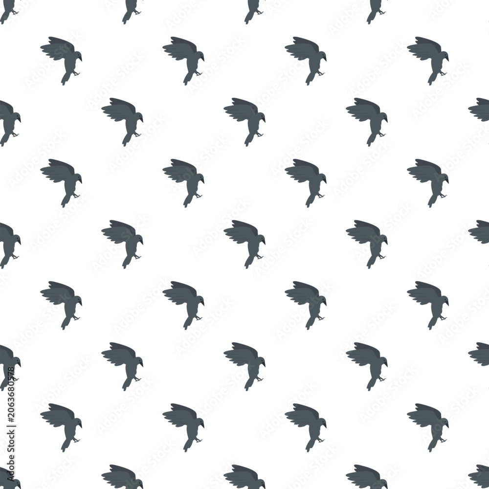 Fototapeta premium Flying dark bird silhouette creating a seamless patterned background