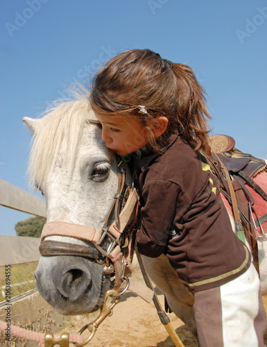 riding child and pony