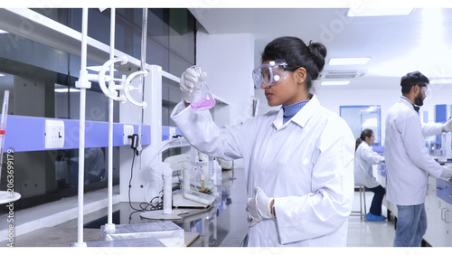 Schilderij op canvas female brown scientist using chemicals in a laboratory