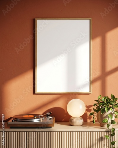 Blank wood frame mockup on terracotta wall above fluted cabinet with vinyl record player