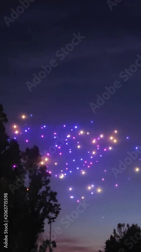 illuminated drones at night, drone show