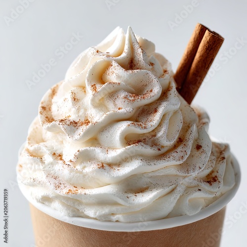 Creamy Cappuccino Coffee Drink with Whipped Cream and Cinnamon Stick