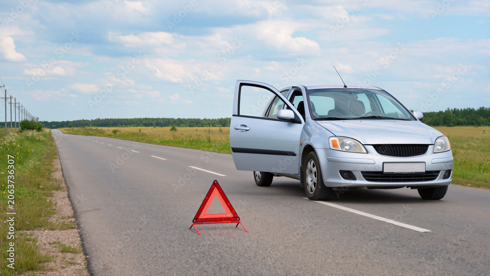 Foto Broken Down Car on the Roadside with Warning Triangle