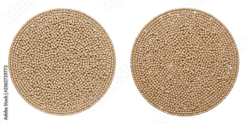 Top view of two circular arrangements of small beige cylindrical pellets isolated on transparent background