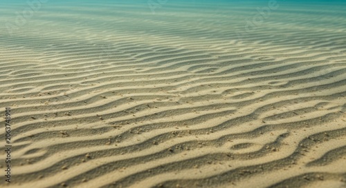 Rippling Sand Patterns Beneath Clear Ocean Water