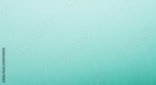 Turquoise abstract rain texture with fine water droplets falling against a bright background for atmospheric overlay, weather editorial and creative digital art