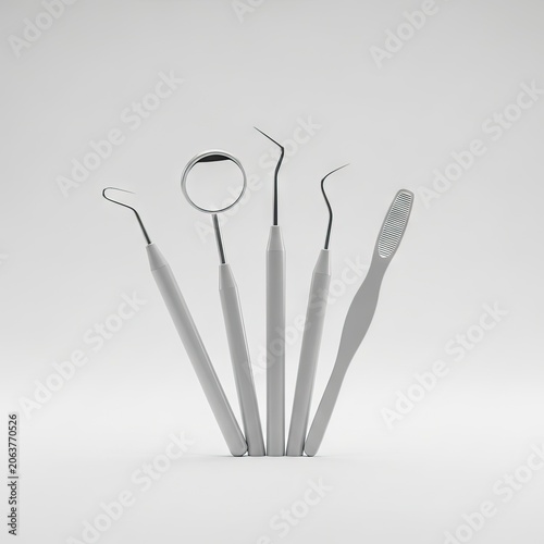 Set of five essential dental tools for oral hygiene and examination, arranged neatly on a clean white background.