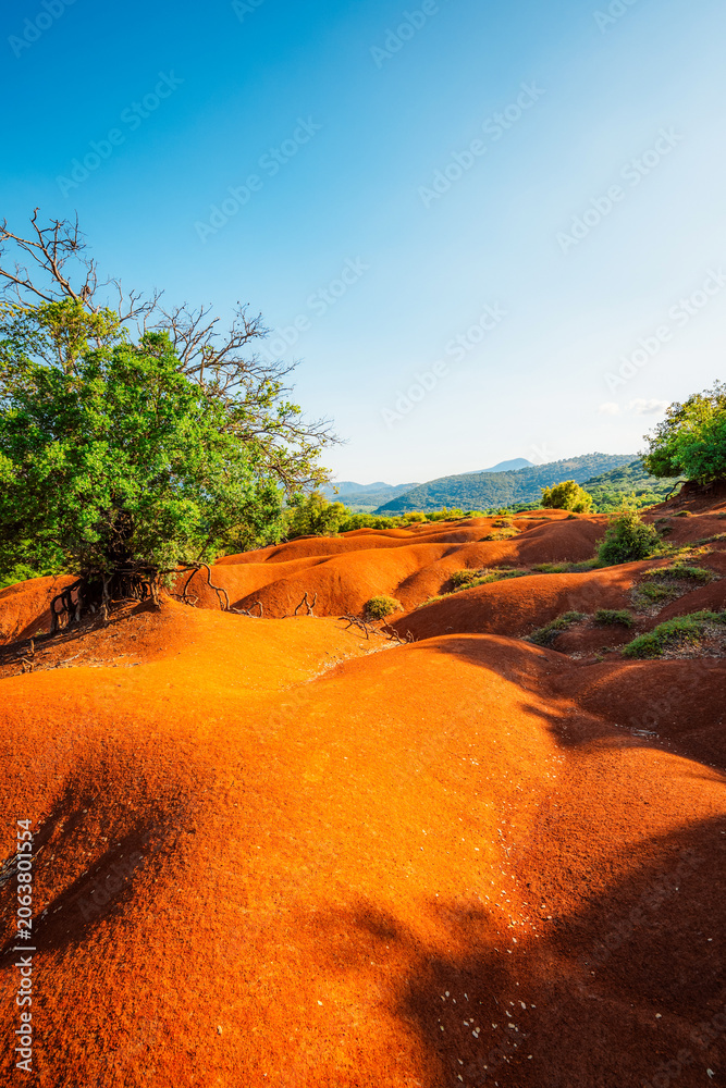 Obraz premium Red clay terrain Kokkinopilos Preveza near Preveza city, in Epirus region, Greece.