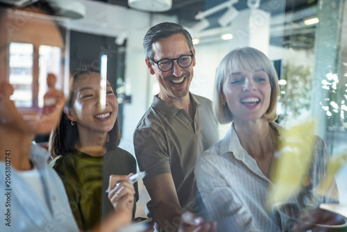 Diverse business team collaborating and brainstorming at office meeting