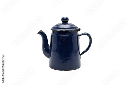 A vintage dark blue enamel teapot with a lid and a curved spout, showing signs of wear and age, isolated on a solid black background, studio shot