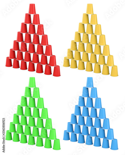 Colorful plastic cups arranged in triangle shapes and isolated on white, symbolizing party games and beverage fun