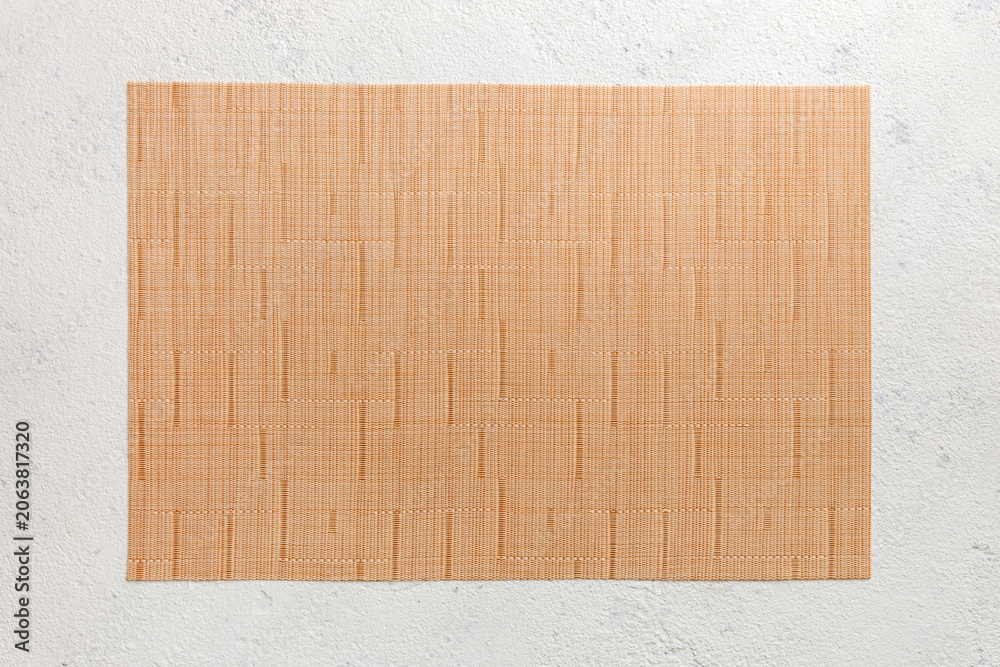 Fototapeta premium Top view of light tablecloth for food on cement background. Empty space for your design