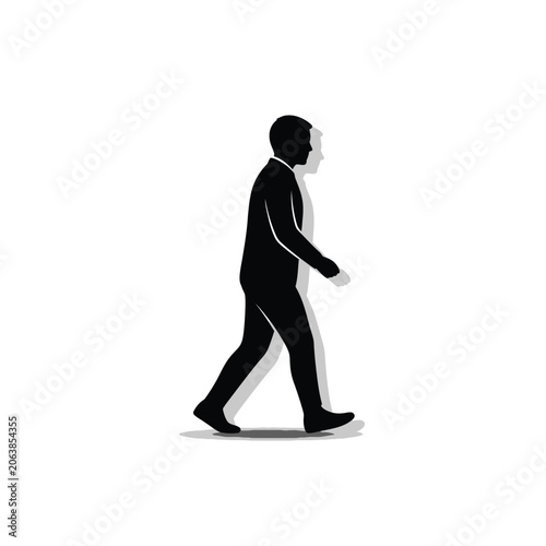 Silhouette of a man walking with shadow.