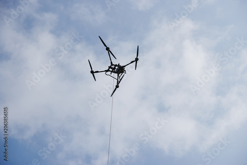Canvas Print Drone flying cart under blue sky