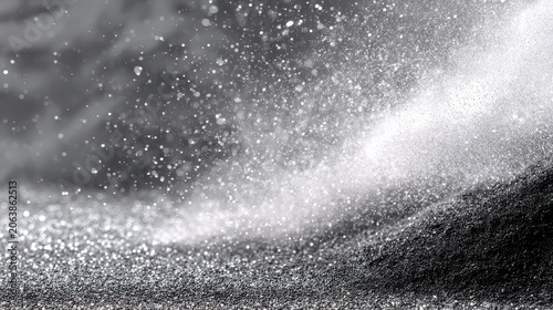 Abstract black and white background showing particle texture in motion. dynamic and moody dark elegant blur effect