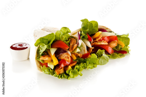 Kebab - grilled meat and vegetables on white background
