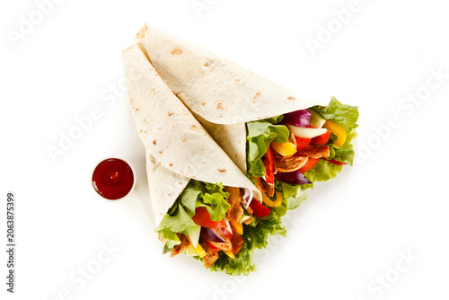 Kebab - grilled meat and vegetables on white background
