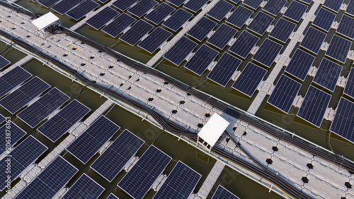 Aerial view of solar panels on water, renewable energy and drone power industry.	