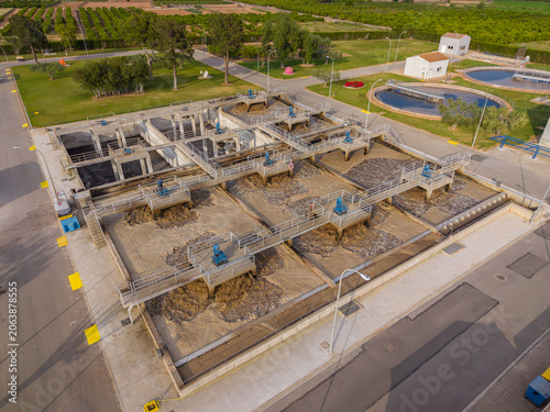 Slika na platnu Overhead view of active wastewater treatment facility showing aeration basins wi