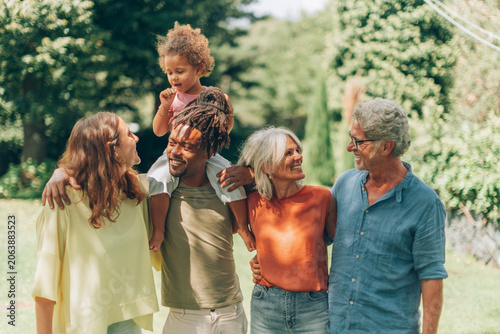 Diverse multigenerational family enjoying time together outdoors