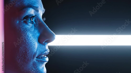 Caucasian woman profile portrait illuminated by neon light scanning across face. Futuristic biometric authentication and medical diagnostic imaging concept sequence