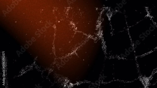Dark grunge overlay featuring cracked textures, distressed surface details, dust particles, and warm orange light leak effects. Ideal for cinematic transitions, horror visuals, vintage film projects, 