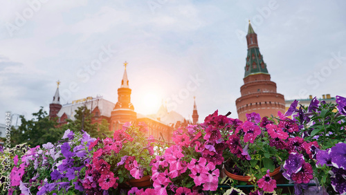 Photography Moscow cityscape with colorful petunias in bloom and sun shining on historic arc