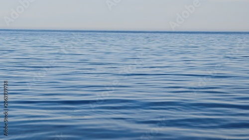 Calm open Mediterranean Sea with gentle blue waves cinematic background 4K