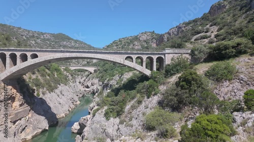 Pont du Diable Bridge Spanning Verdant Gorge in Occitanie, France