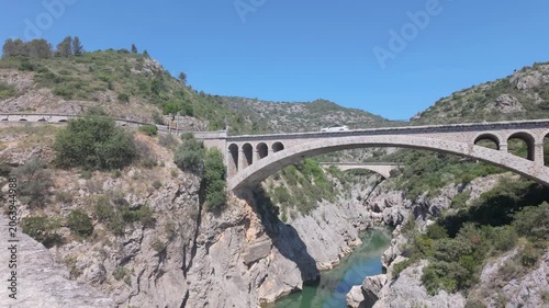 Pont du Diable Bridge Spanning Verdant Gorge in Occitanie, France