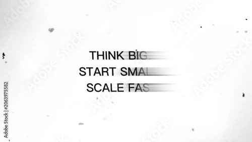 Blurry gray text on white background with speckles