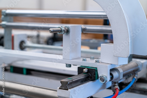 Bild auf Leinwand Industrial machine mechanism showing linear guide and pneumatic actuator control