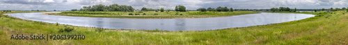 Panoramic view on a bend of the River Meuse in the Maas valley river park on the Netherlands Belgium border, designed for water storage and nature restoration