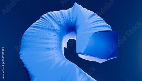 Abstract blue fabric twisted in a spiral shape on a dark blue background.