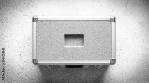 Silver flight case with foam interior and rectangular cutout overhead view