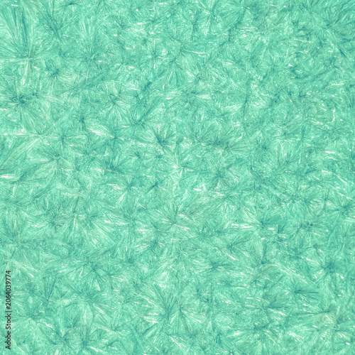 Macro photography of abstract emerald green mineral texture resembling malachite and jade, square crop