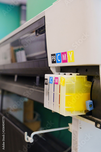 CMYK Color Ink Containers on Wide Format Printing Equipment