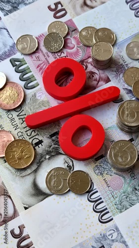 The percentage sign on cash as a concept for inflation, deposits, or tax liabilities. The percentage sign as a financial background for your design