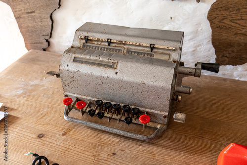Obraz na płótnie Antique Mechanical Adding Machine Calculator on Table