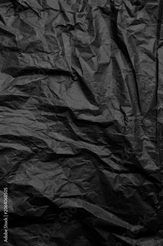 Dark academia black crumpled paper texture, wrinkled charcoal noir background for minimalist luxury branding
