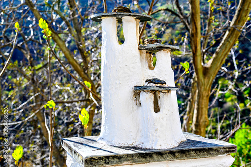 Characteristic chimneys of the village of Pampaneira in the Alpujarra of Granada, with its steep streets and water channels