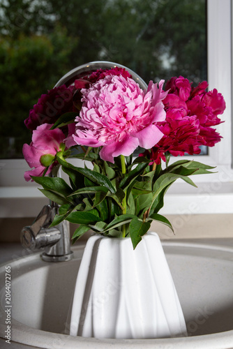 lush fragrant pink peonies in the interior