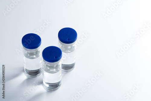 Pharmaceutical injection bottles isolated with copy space