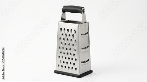 kitchen utensil, this multi-sided metal box grater is ready for food preparation tasks such as shredding cheese or grating vegetables.